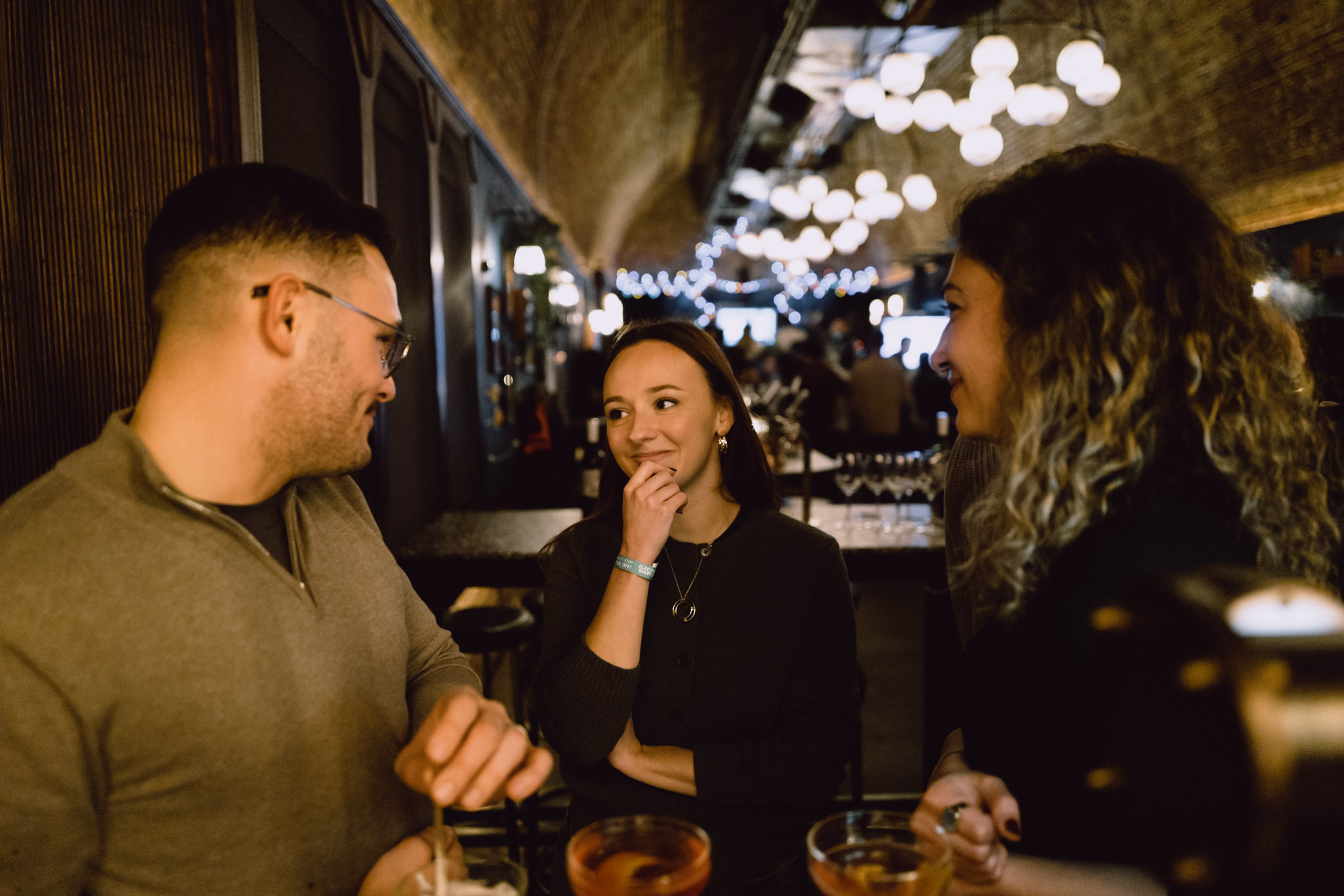 Team event photography — warm ambient light, social setting.