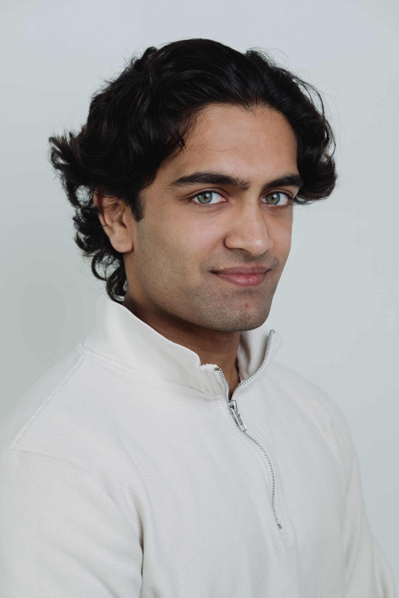 Professional headshot — consistent studio framing.