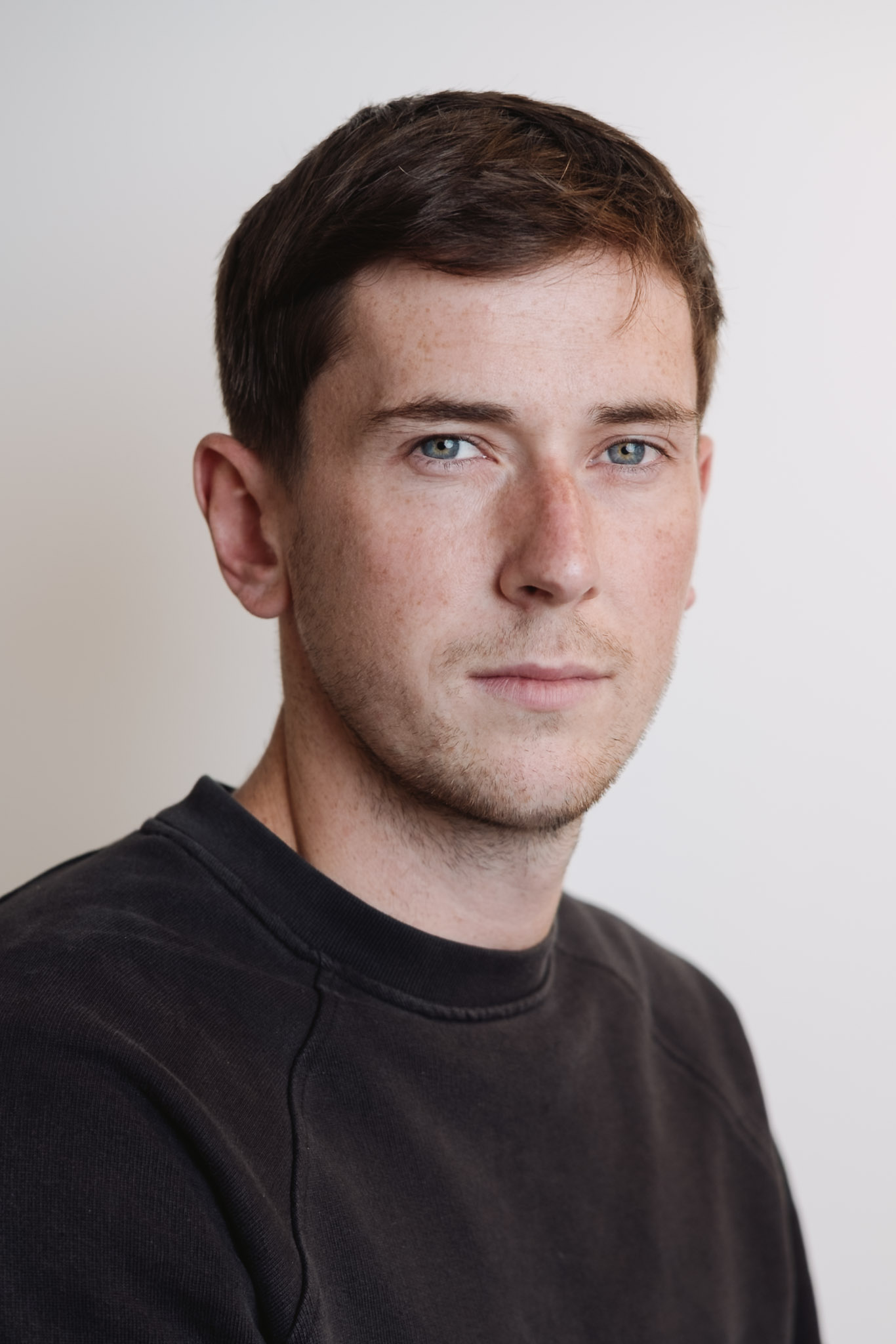 Corporate headshot — professional studio portrait.