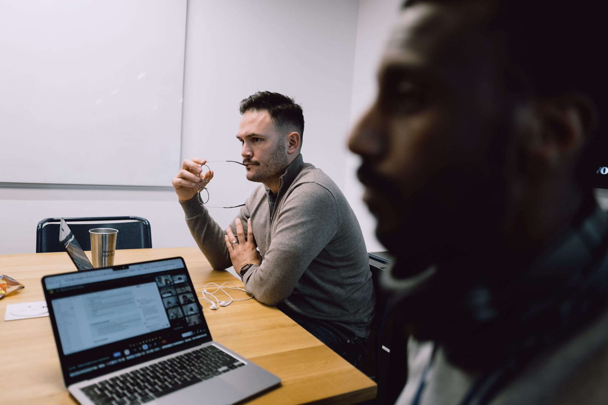 Office portrait — professional in thoughtful moment, workplace setting.